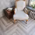 Кварцвиниловый SPC ламинат Vinilam Parquet Herringbone Паркет Эрмитаж IS11122 венгерская елка 720×120×6,5 фото в интерьере