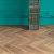 Кварцвиниловый SPC ламинат Vinilam Parquet Chevron Шеврон Нормандия RI153610CL4 французская елка 1293×305×8,5 фото в интерьере