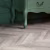 Кварцвиниловый SPC ламинат Vinilam Parquet Chevron Шеврон Шампань RI153616CL4 французская елка 1293×305×8,5 фото в интерьере