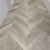 Кварцвиниловый SPC ламинат Vinilam Parquet Chevron Шеврон Сезар RI4445118CL4 французская елка 1293×305×8,5 фото в интерьере