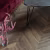 Кварцвиниловая плитка Vinilam клеевая Parquet Chevron Glue Шеврон Лувр I107516 французская елка 690×115×2,5 фото в интерьере